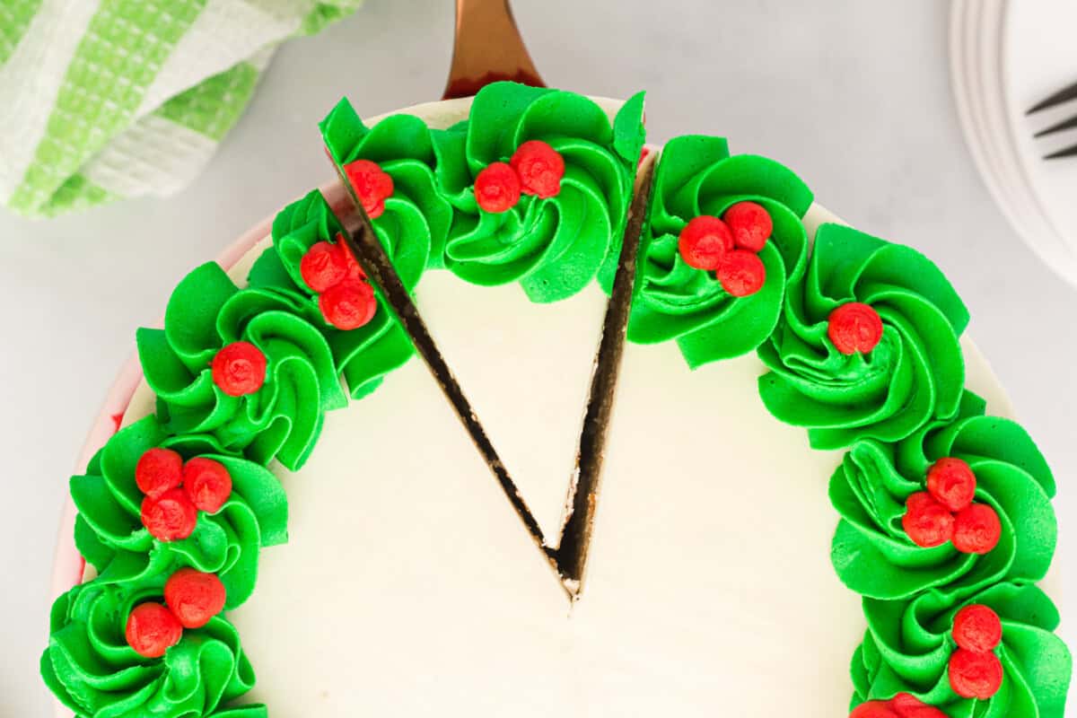 overhead view of christmas wreath cake, with green frosting around the edges