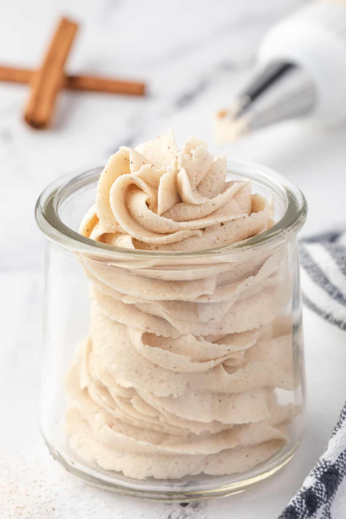 a small jar of brown sugar buttercream frosting