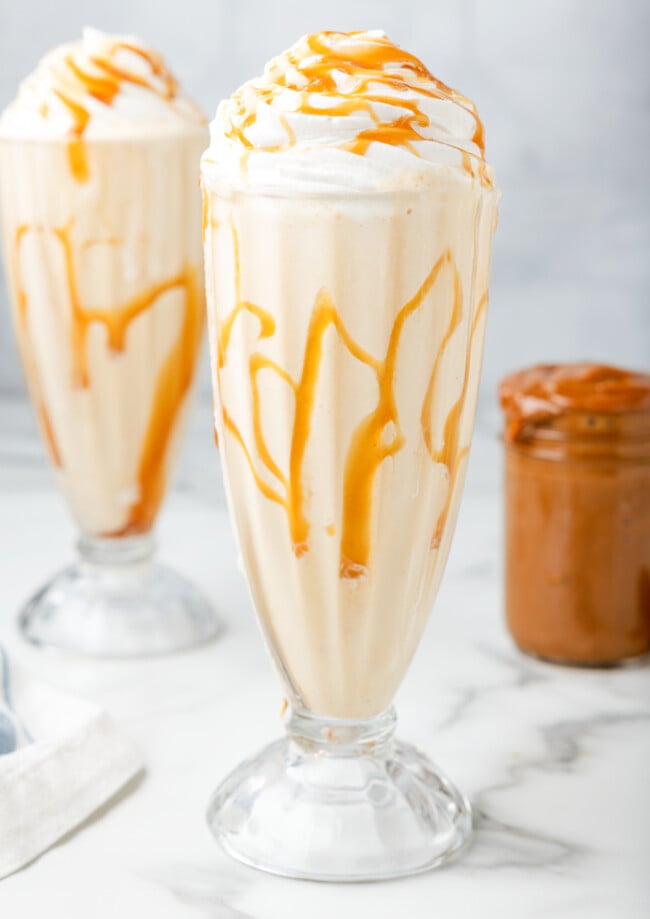 dulce de leche milkshakes in ice cream glasses
