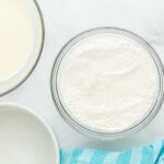 overhead view of dry ingredients for airplane cake in a glass bowl.