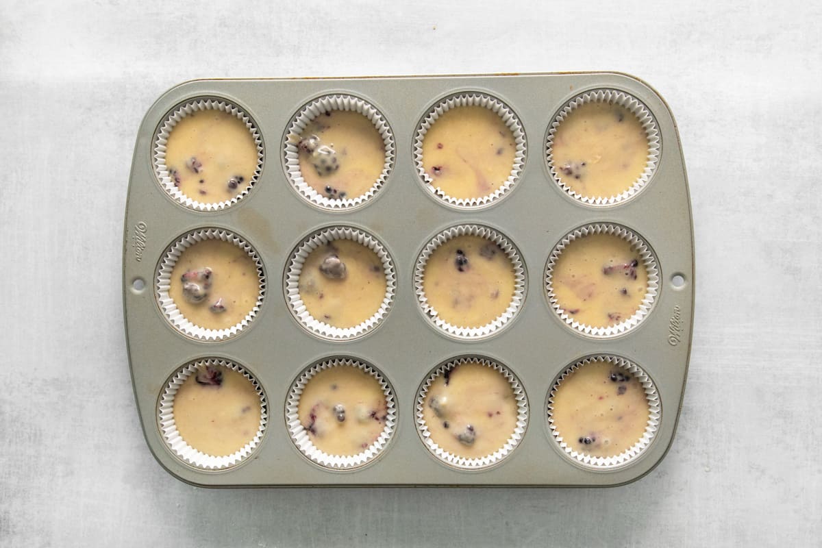 cupcake tin filled with batter, before baking