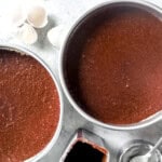 round cake pans filled with batter