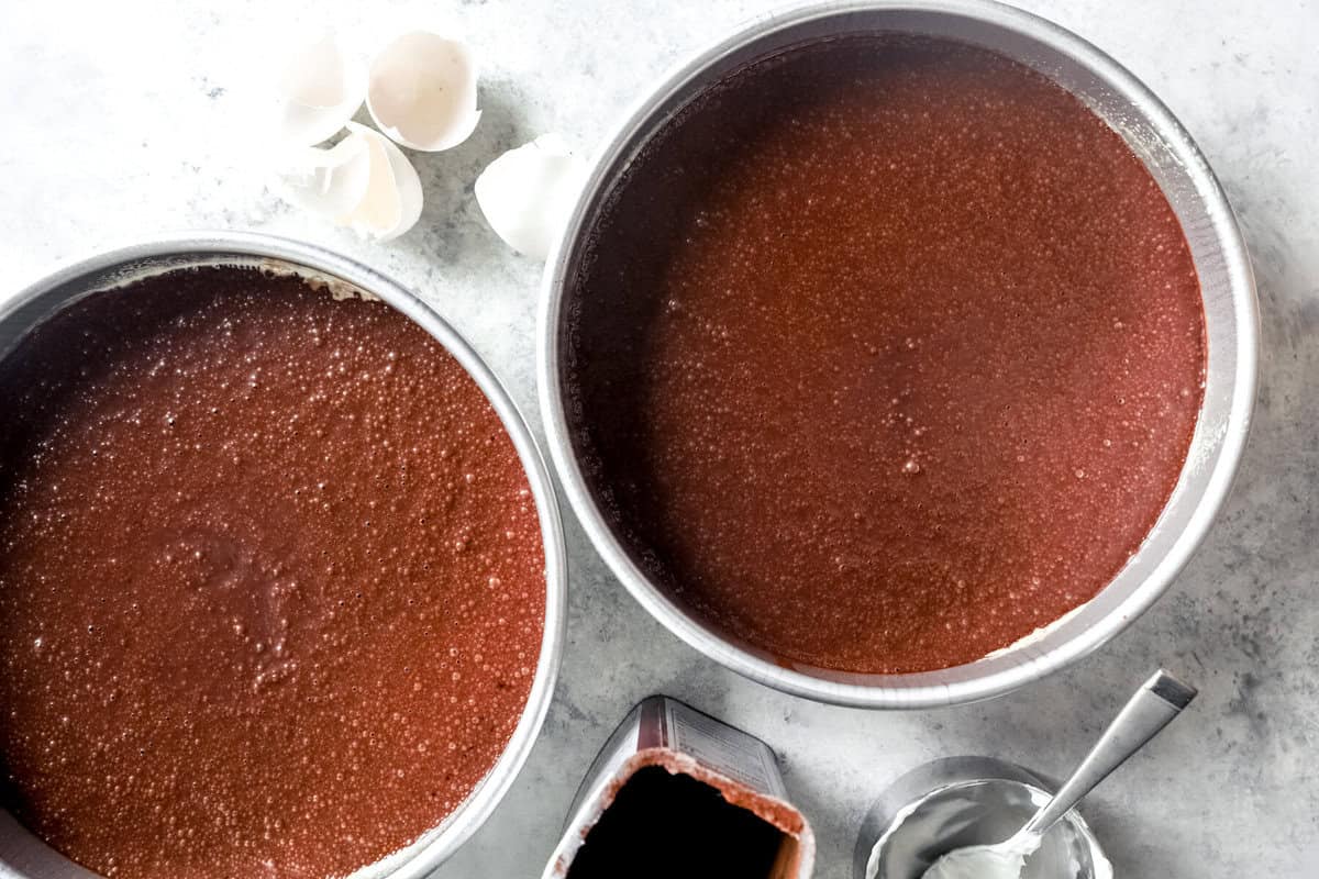 round cake pans filled with batter