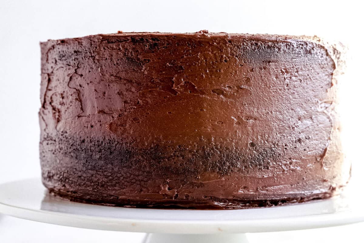 frosted cake on a cake stand