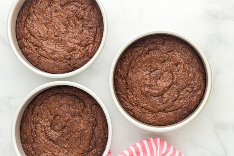 baked brownie cake layers in 8-inch round cake pans.