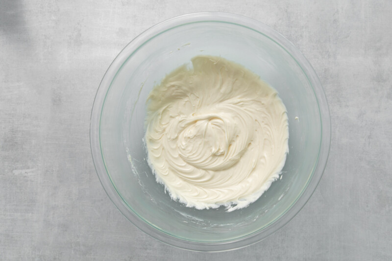 cream cheese frosting in a glass bowl.