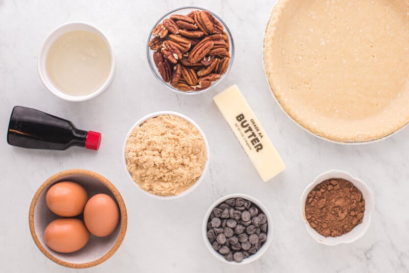 overhead view of ingredients for chocolate pecan pie.