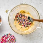 mixing sprinkles into cookie dough