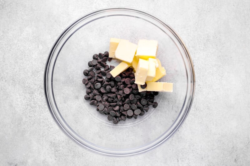chocolate chips and cubes of butter in a bowl