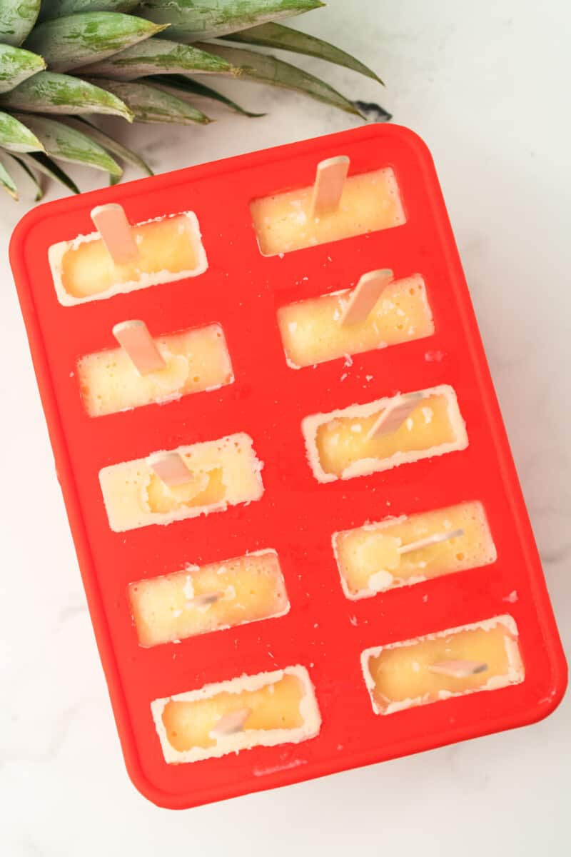 pineapple popsicles in a popsicle mold