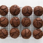 double chocolate muffins lined up on a cooling rack