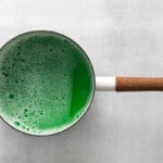 green food coloring added to liquid gelatin mixture in a saucepan.