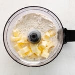 cubes of butter and dry ingredients in a food processor