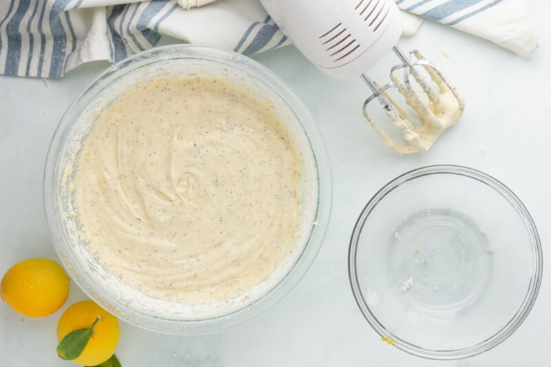 lemon poppy seed muffin batter in a glass mixing bowl