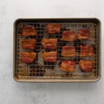 pieces of bacon on a baking tray