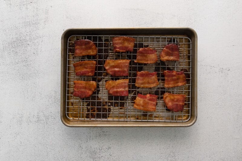 pieces of bacon on a baking tray