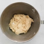 maple pecan biscotti dough in a stainless mixing bowl.