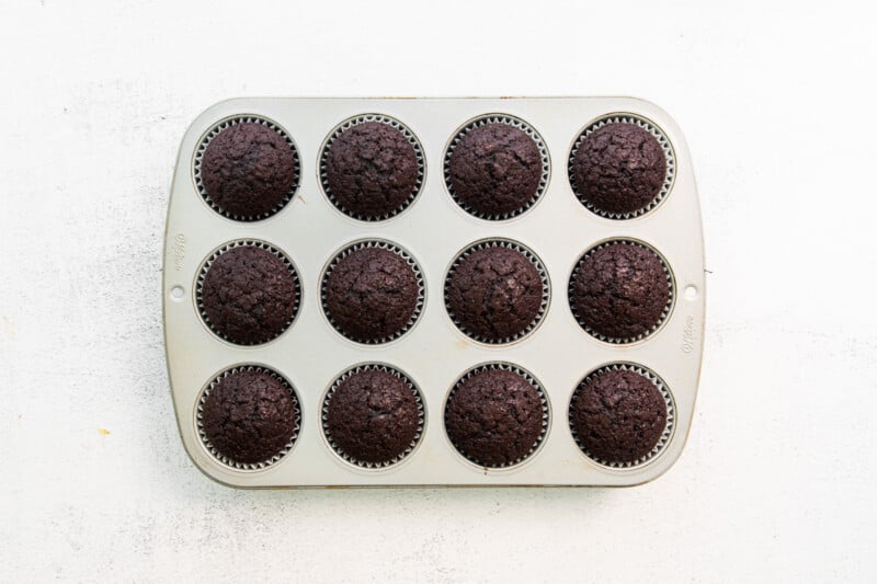 chocolate cupcakes in a muffin tin.