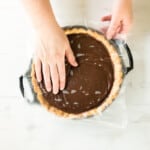 covering chocolate pie with a piece of wax paper