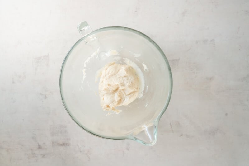 whipped cream in a glass bowl on a white background.