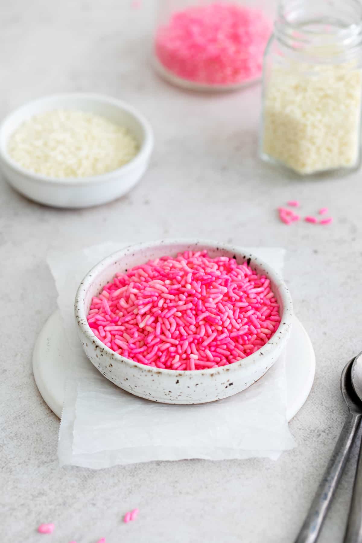 a bowl of DIY dyed sprinkles