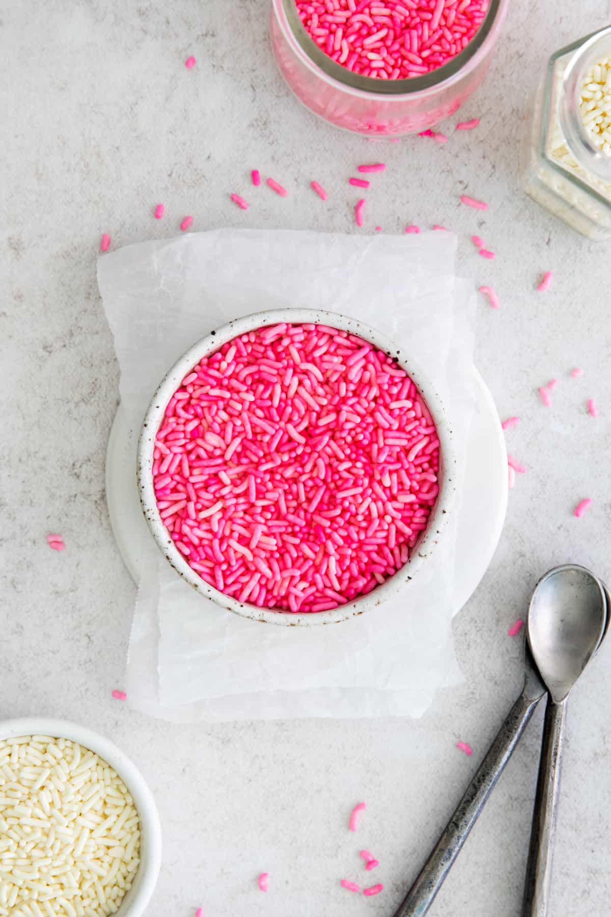 a bowl of bright pink sprinkles