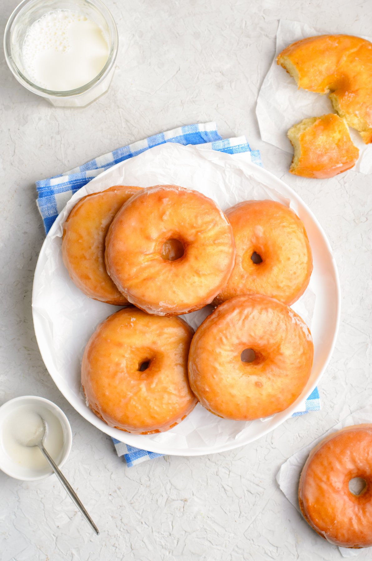 a plate of Krispy Kreme glazed donuts
