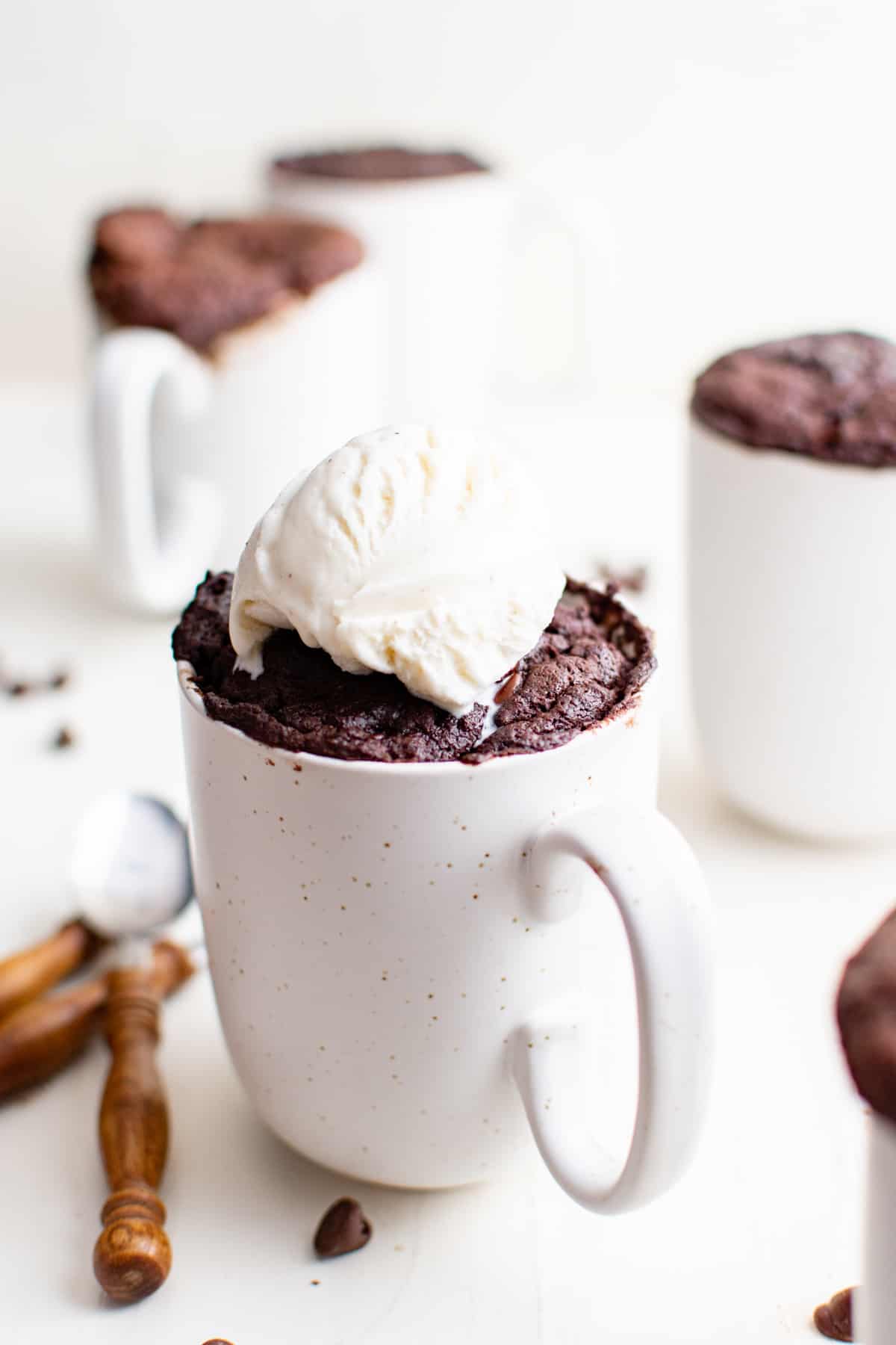 mug filled with a microwave brownie, topped with ice cream