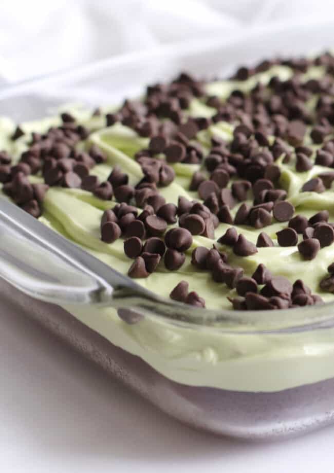 close up mint chocolate chip brownies in a glass pan