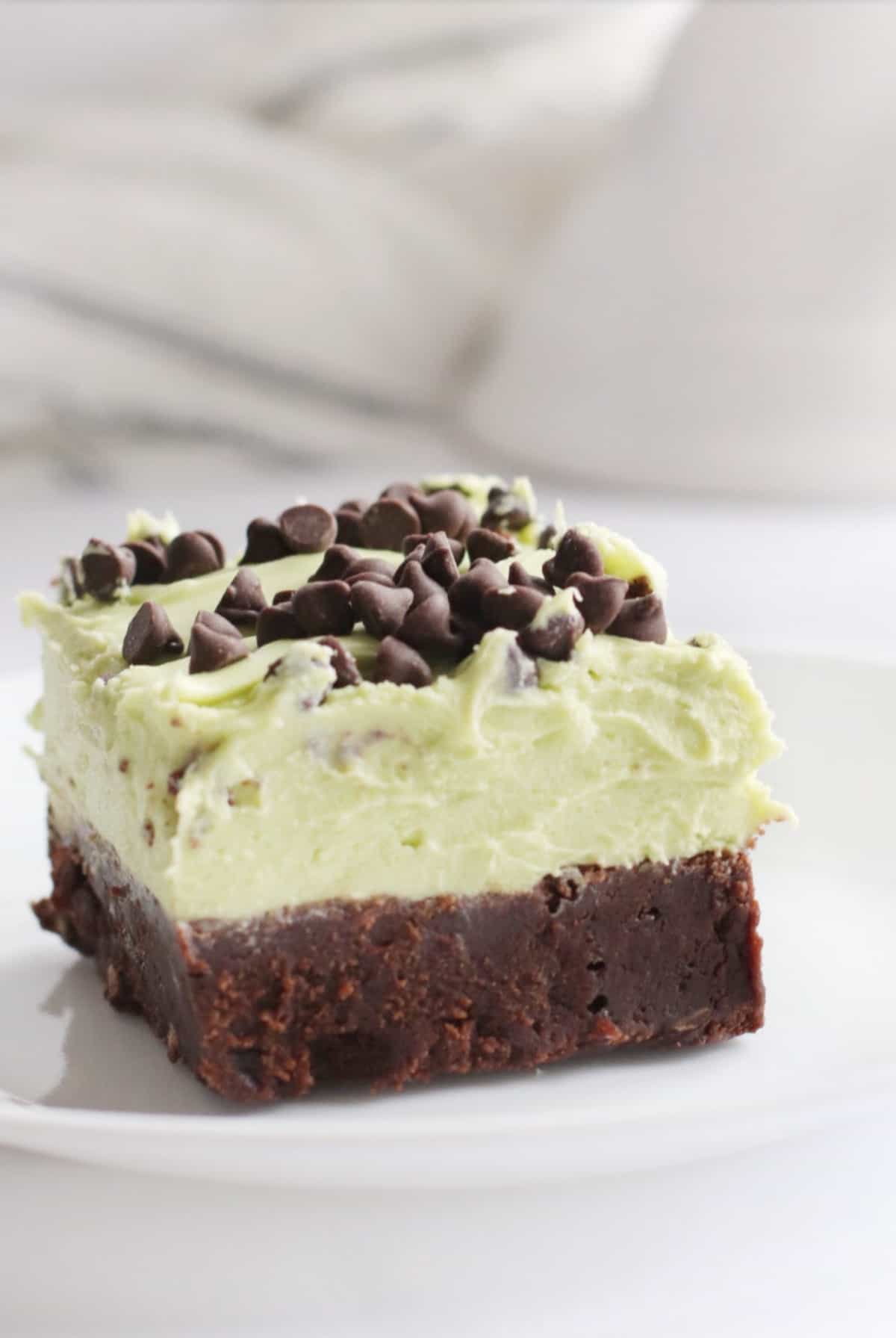 mint chocolate chip brownie cut into a square