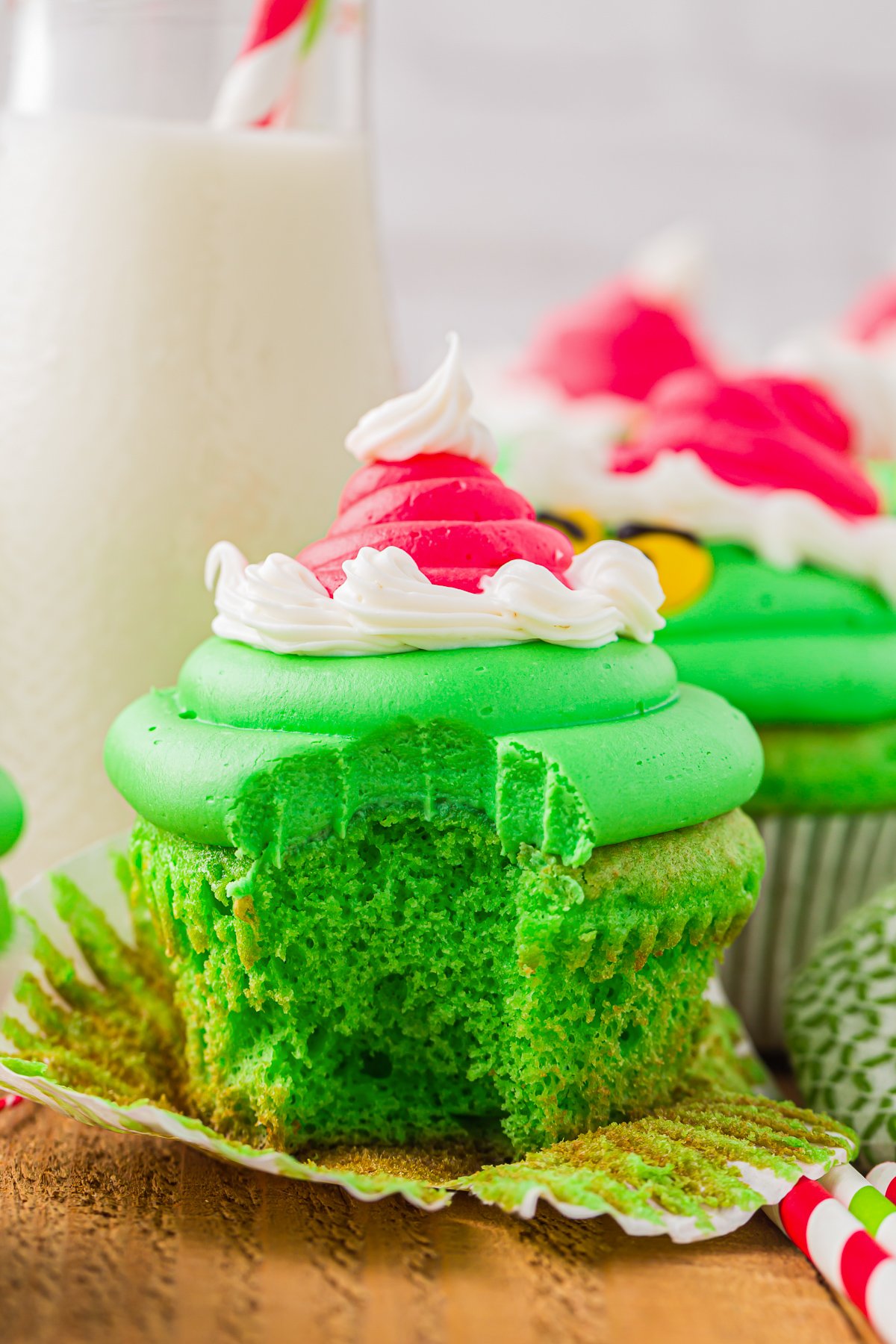 grinch cupcake with a bite taken out of the front