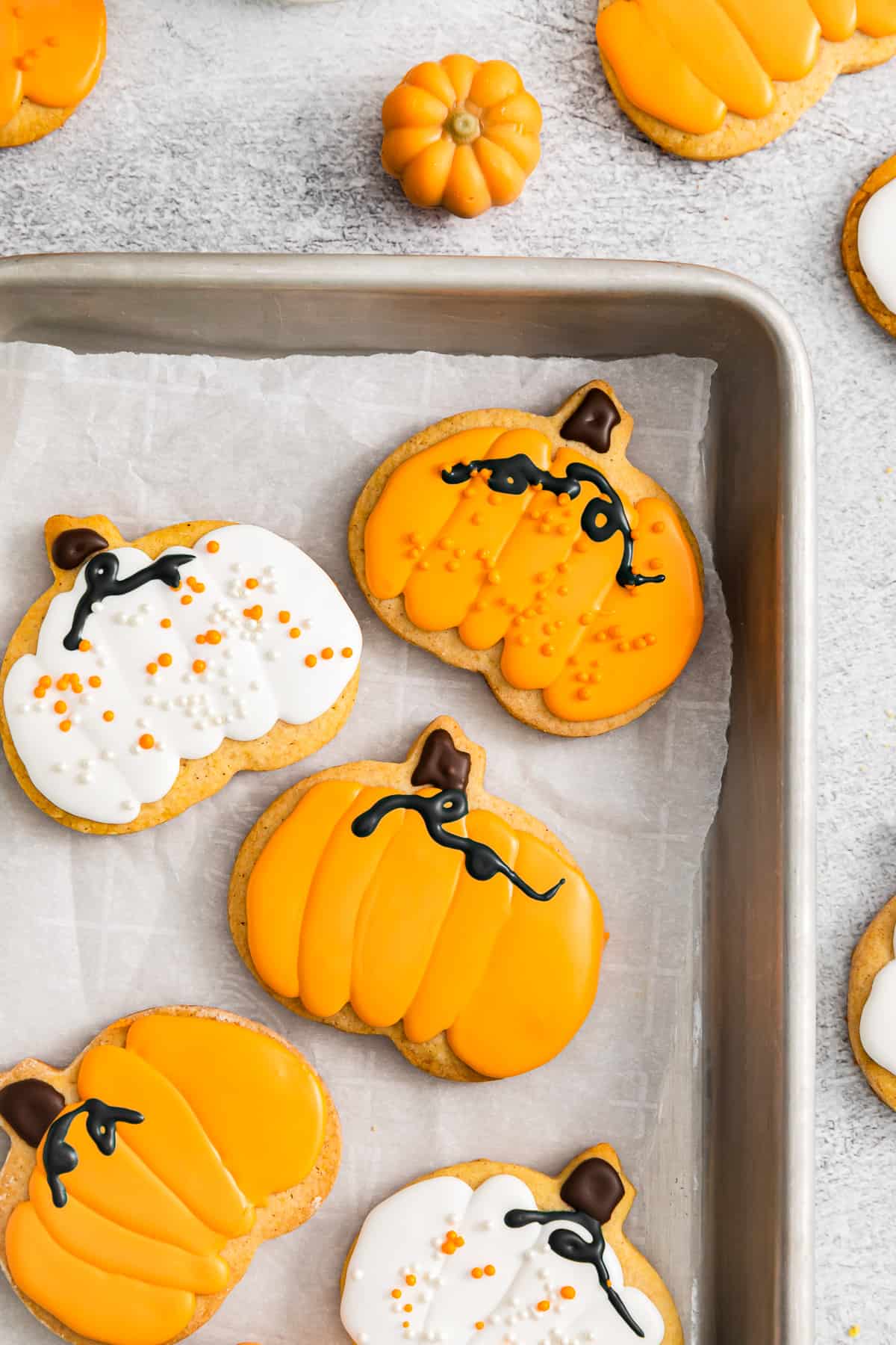 pumpkin sugar cookies on a baking tray
