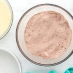 dry ingredients for chocolate cake in a glass bowl.