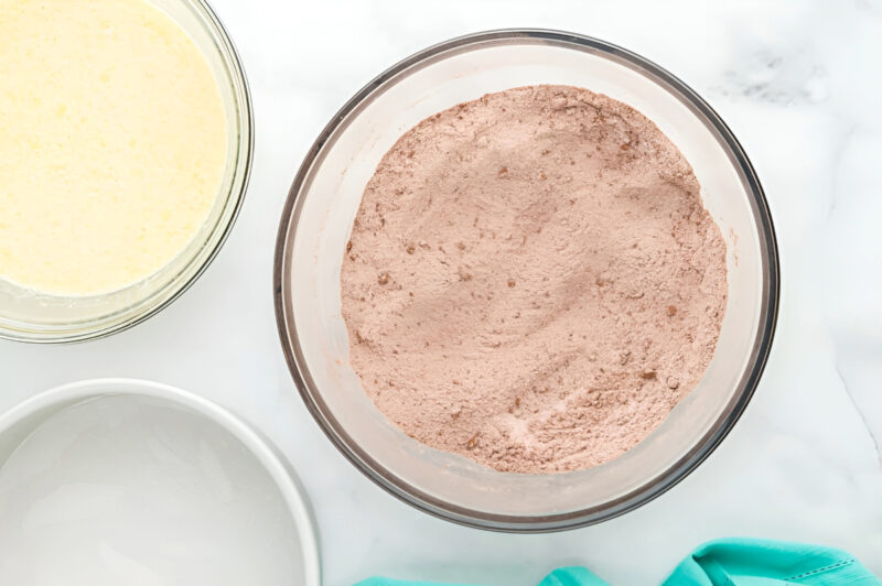 dry ingredients for chocolate cake in a glass bowl.