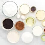 portioned ingredients for chocolate oreo cake in individual bowls.