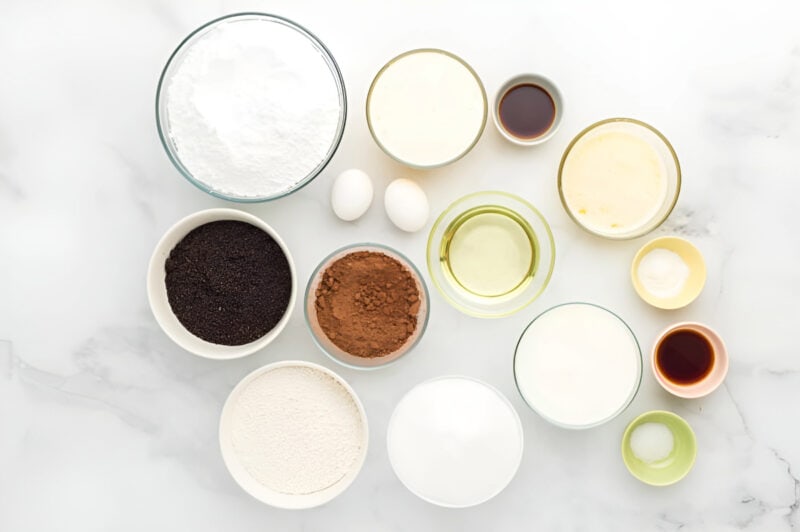 portioned ingredients for chocolate oreo cake in individual bowls.