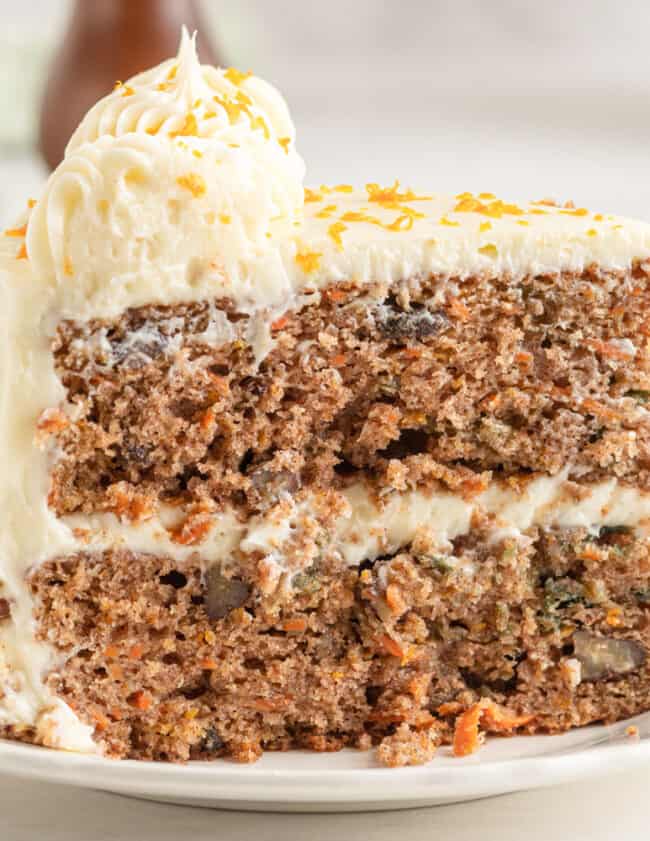 a slice of carrot cake on a plate.