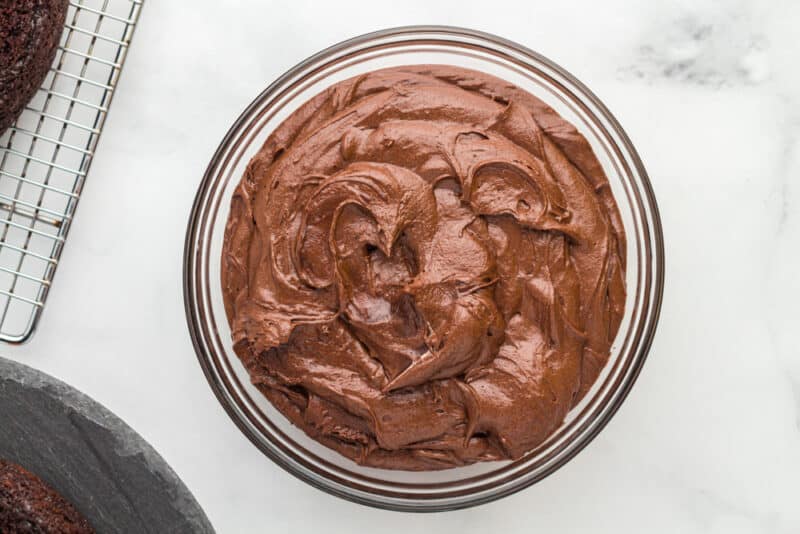 frosting for chocolate fudge cake in a glass bowl.