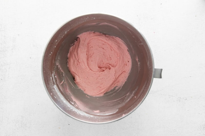 raspberry buttercream in a stainless mixing bowl.