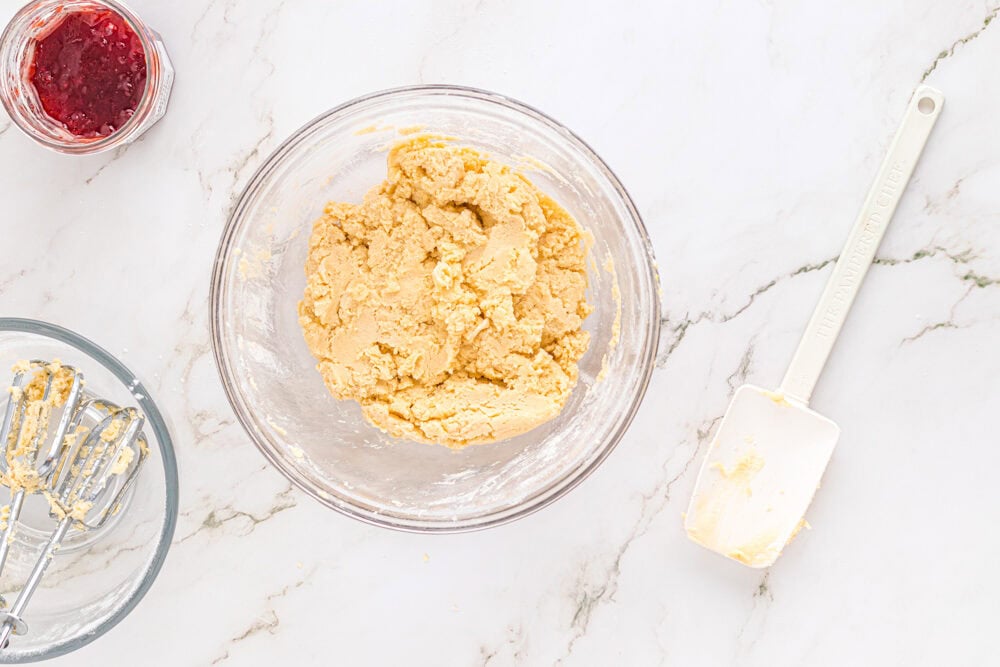 heart thumbprint cookie dough in a glass bowl.