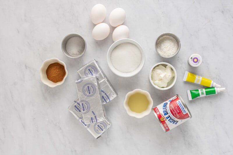 ingredients for king cake cheesecake in individual bowls.