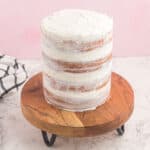 naked cake on a wooden cake board.