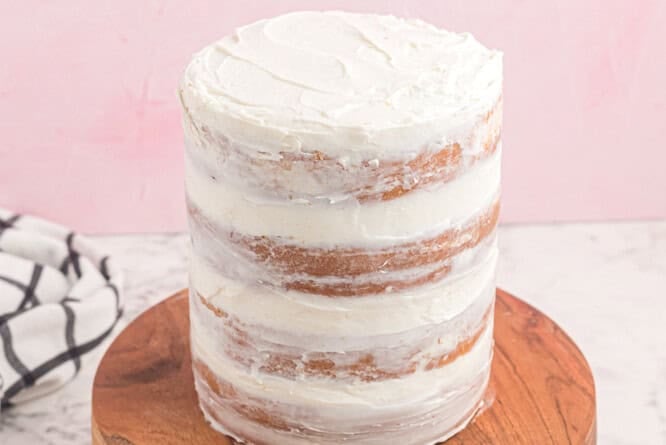 naked cake on a wooden cake board.