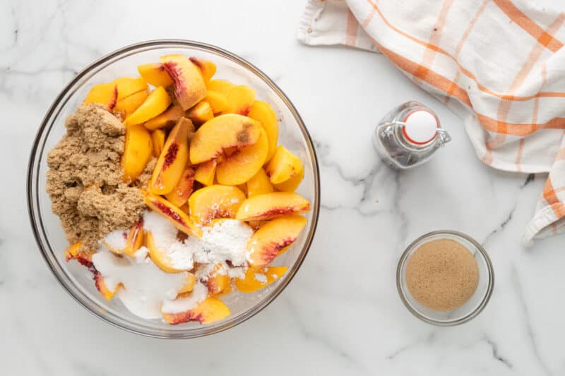 peach cobbler filling ingredients in a bowl