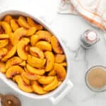baking dish filled with peach slices
