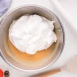 a bowl of cream in a bowl with a spoon.