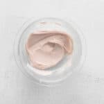 raspberry macaron buttercream in a glass bowl.