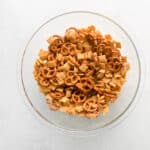 a bowl of pretzels on a white background.