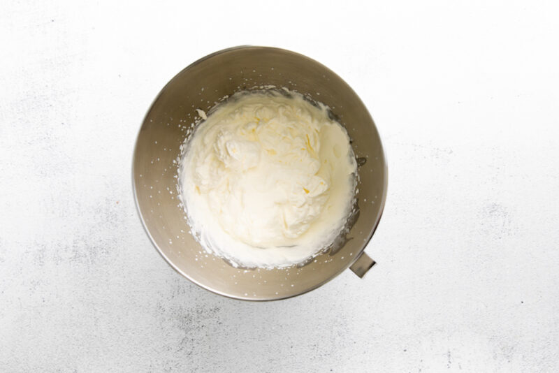 whipped heavy cream in a stainless mixing bowl.