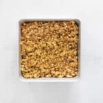 peanut butter granola in a square baking pan.